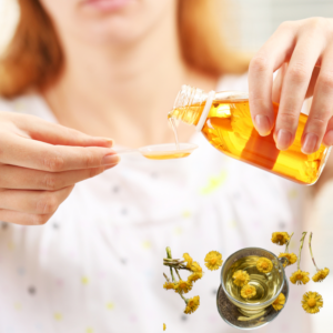 Person pouring a herbal liquid into a spoon, with coltsfoot flowers and tea in the foreground.